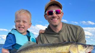 Father and son with fish they caught