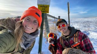 Cayla with husband and dog after a successful hunt